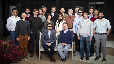 25 physicists and material scientists pose for a picture