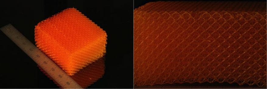 A three-dimensional printed electrode sample fabricated on a large-area projection micro-stereolithography system with engineered porosity (left), and a magnified view of the sample showing the tailored architecture (right).
